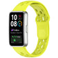 Bright yellow-green perforated TPU watch band fitted to a silver smartwatch