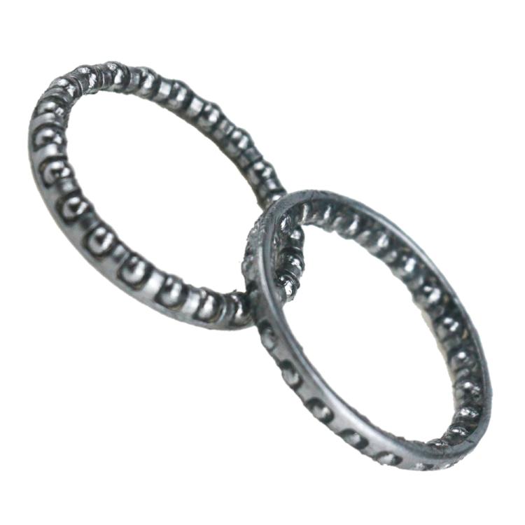 Wheel bearing cup assembly with steel bearing rings