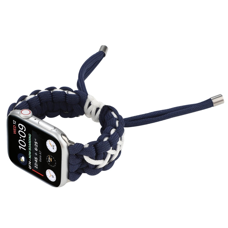 Braided umbrella cord watch strap close-up, dark blue with white accents and silver end tips