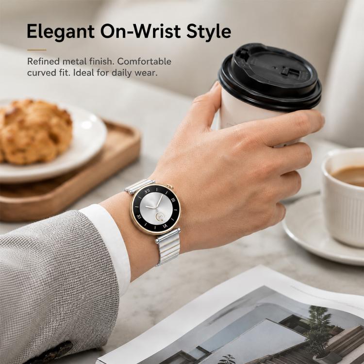 Silver stainless steel watch band worn on the wrist