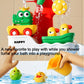 Baby bath play shower duck toy with red sprayer and water stream into the tub