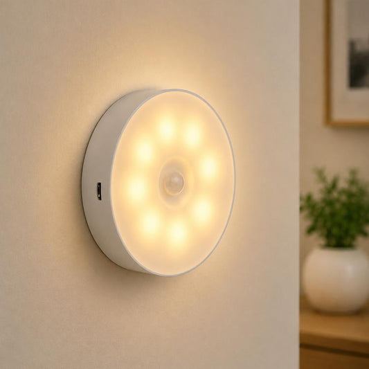 Round wall-mounted LED night light, warm glow, gray housing with small control