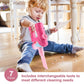 Pretend vacuum cleaner toy held in hands, pink body with blue nozzle and base stand