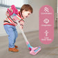 Pink toy vacuum cleaner with flexible handle and base, used by a child