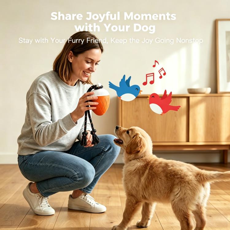 Orange automatic pet toy ball with white top and dark rope, held by person and dog