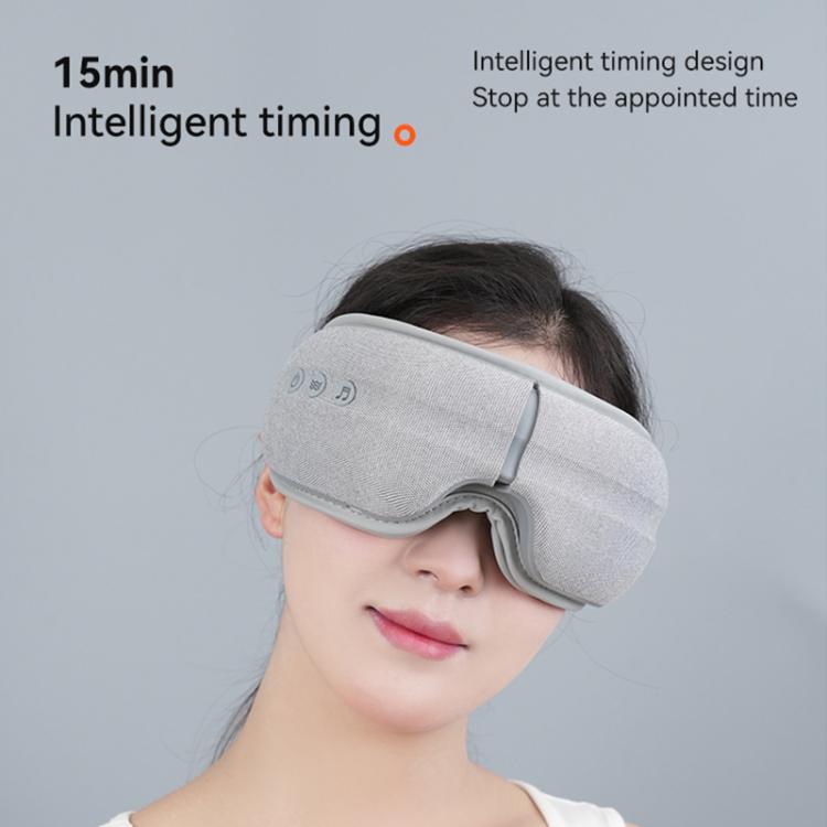 Gray eye heat massager with contoured side padding and soft head strap