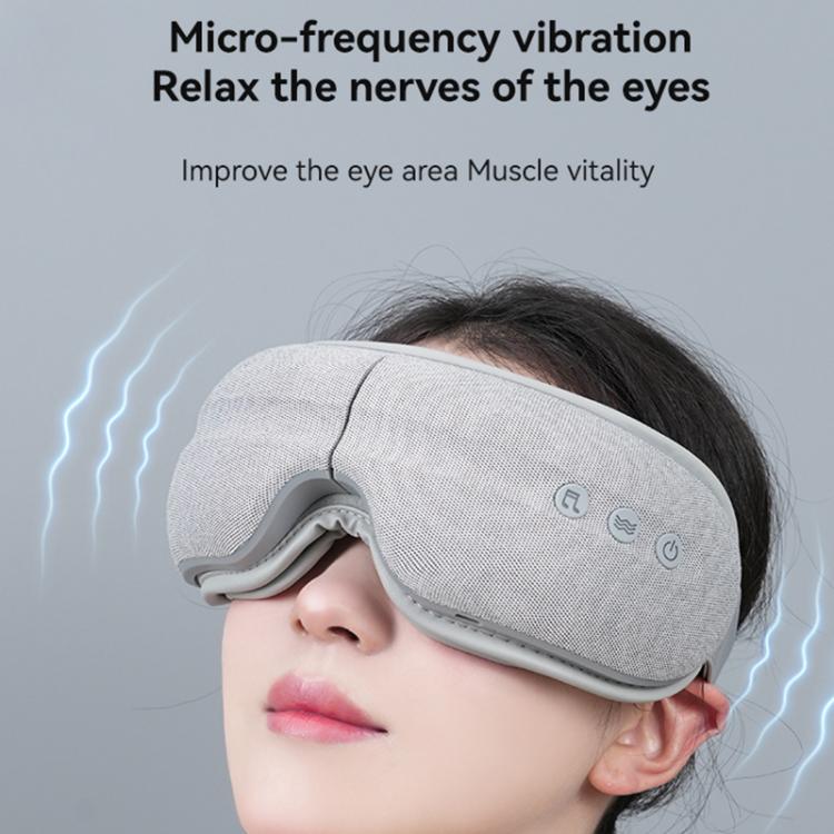 Gray vibrating eye massager mask with side control buttons