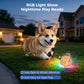 Orange LED dog toy ball glowing at night, with blue pattern and fuzzy spinning brush arms