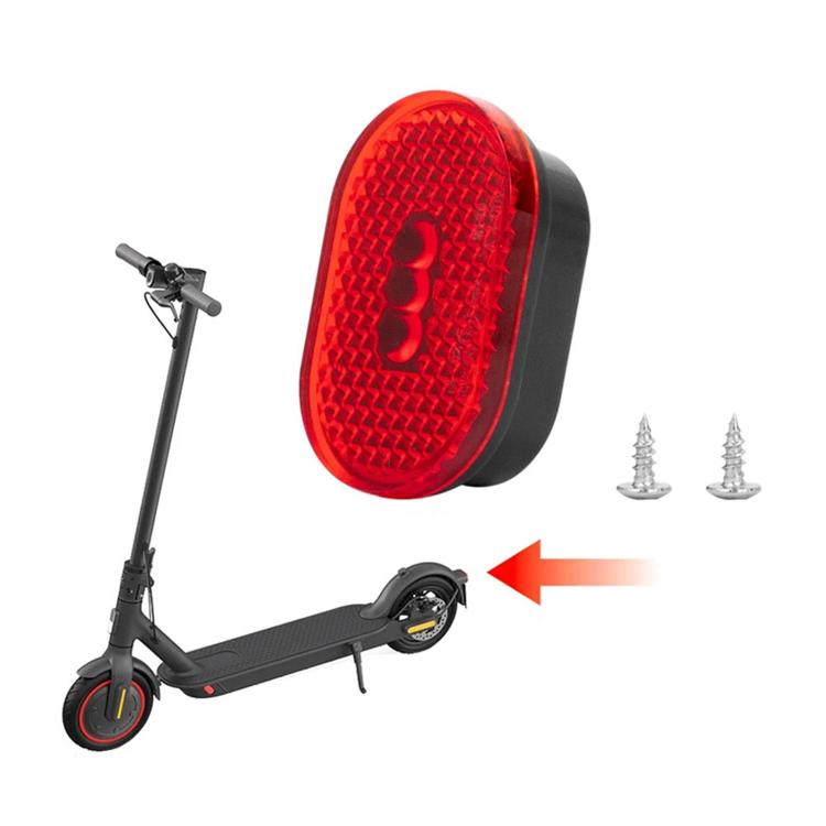 Red oval taillight lens and black housing with mounting screws for scooter