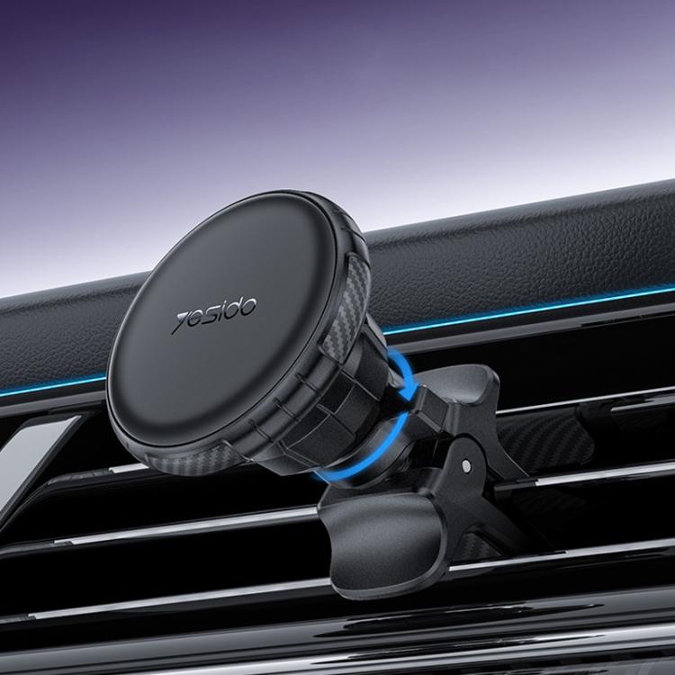 Black magnetic car air vent phone holder with circular mount and spring clamp