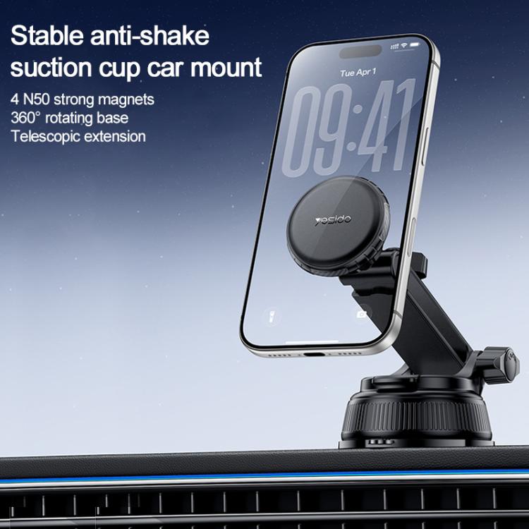 Black car suction cup magnetic phone mount with telescopic arm and rotating base, holding a phone