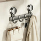No-drill suction cup hook rack, brushed metal bar with multiple hooks holding handbags and coats