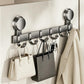 No-drill suction cup hook rack, brushed metal hooks and two suction mounts holding accessories