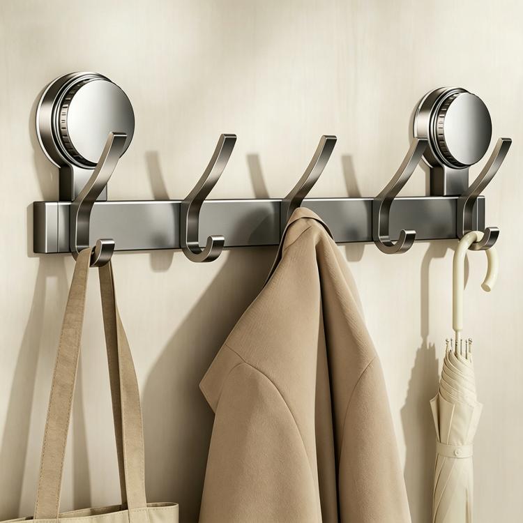 No-drill suction cup hook rack with metal rail, multiple curved hooks, and coat hangers