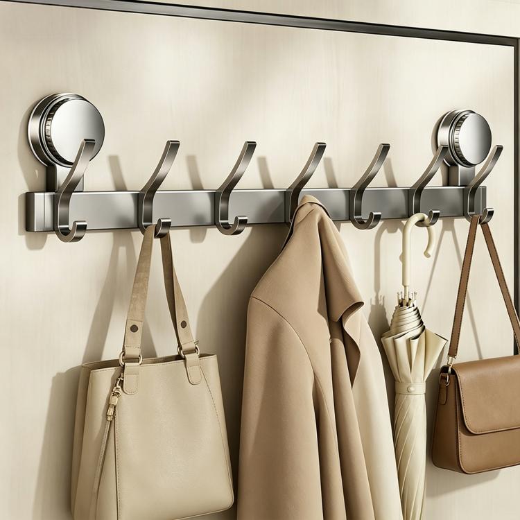 No-drill vacuum suction cup hook rack with multiple chrome hooks holding coats and bags
