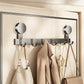 No-drill vacuum suction cup hook rack with chrome hooks holding coats, umbrella, and handbag