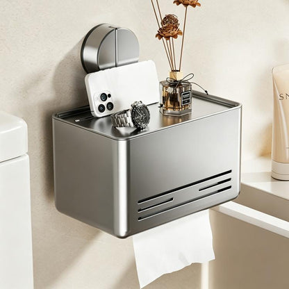 Grey no-drill suction cup tissue holder with front vents and roll storage shelf