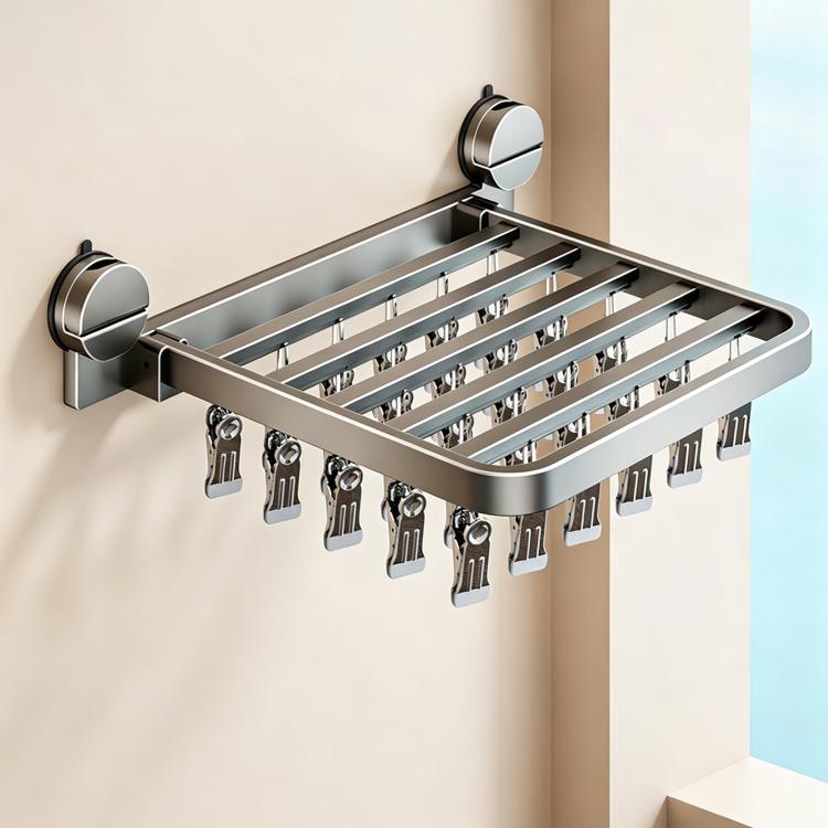 Stainless steel suction cup folding drying rack with rows of clips for laundry drying