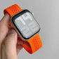 Orange knitted nylon watch band fitted to a smartwatch