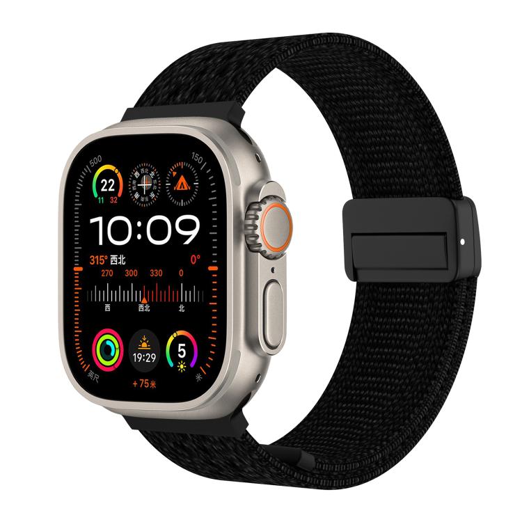 Black knitted nylon watch band with a black magnetic buckle, shown on a watch