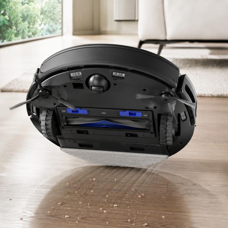 Robot vacuum underside with open dust bin area and installed filter compartment