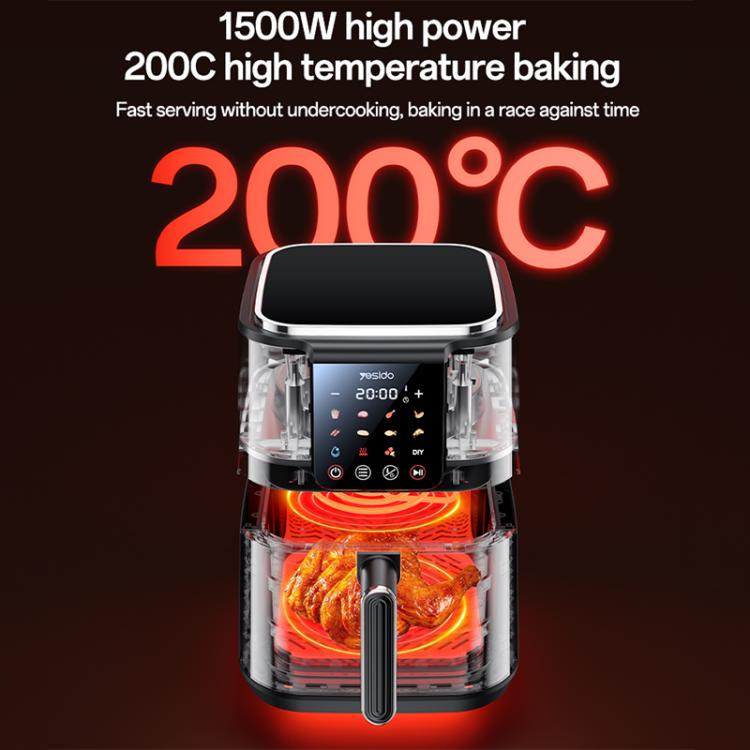 Black air fryer with see-through cooking chamber and heating glow