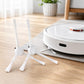 Robot vacuum with two white side brushes extended on light hardwood floor