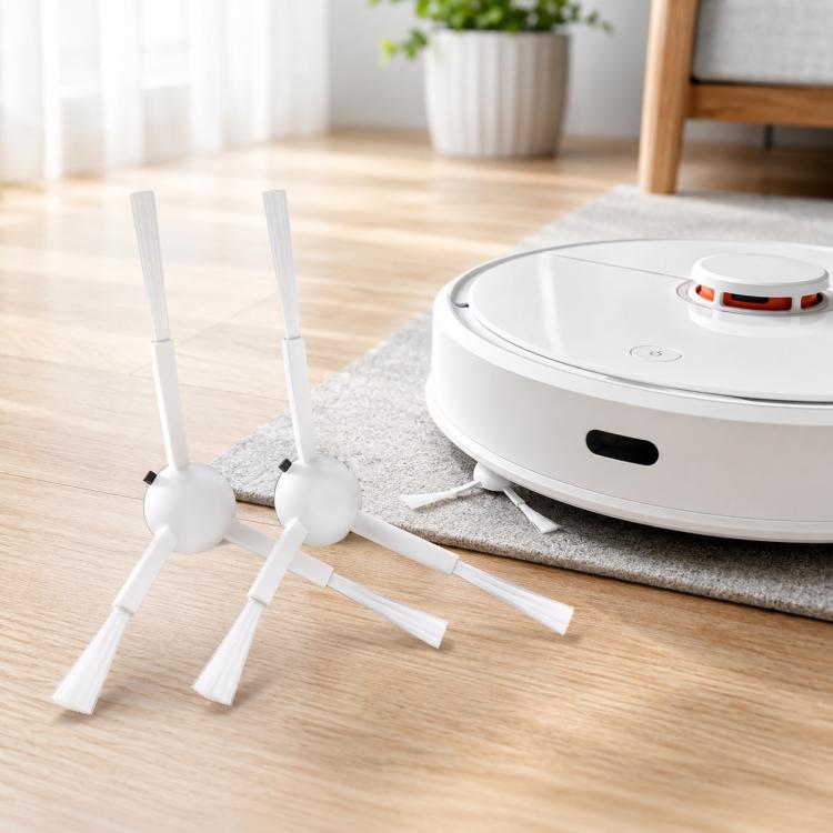 Robot vacuum with two white side brushes extended on light hardwood floor