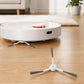 Robot vacuum base with two white side brushes and a spare brush on floor