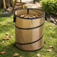 Beige foldable camping bucket with leaves inside, round opening and side handles