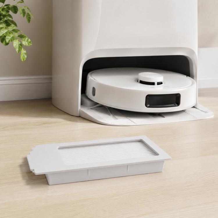 White pleated filter panel in dust tray for robot vacuum