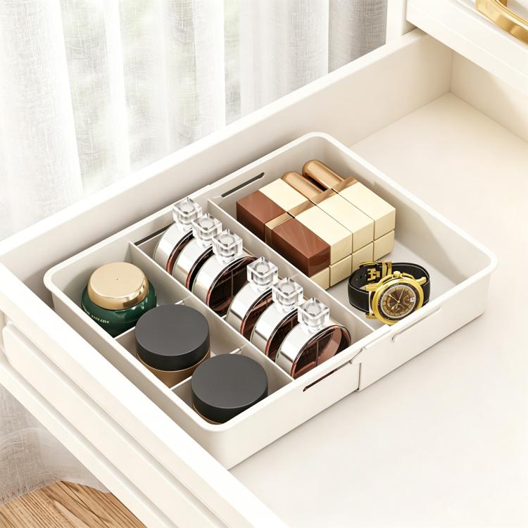 White divided drawer storage box with multiple compartments for small items and bottles