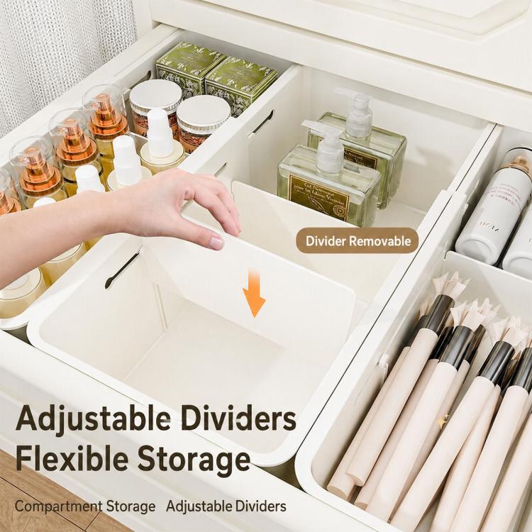White compartment organizer in an open drawer with adjustable dividers and cosmetic bottles