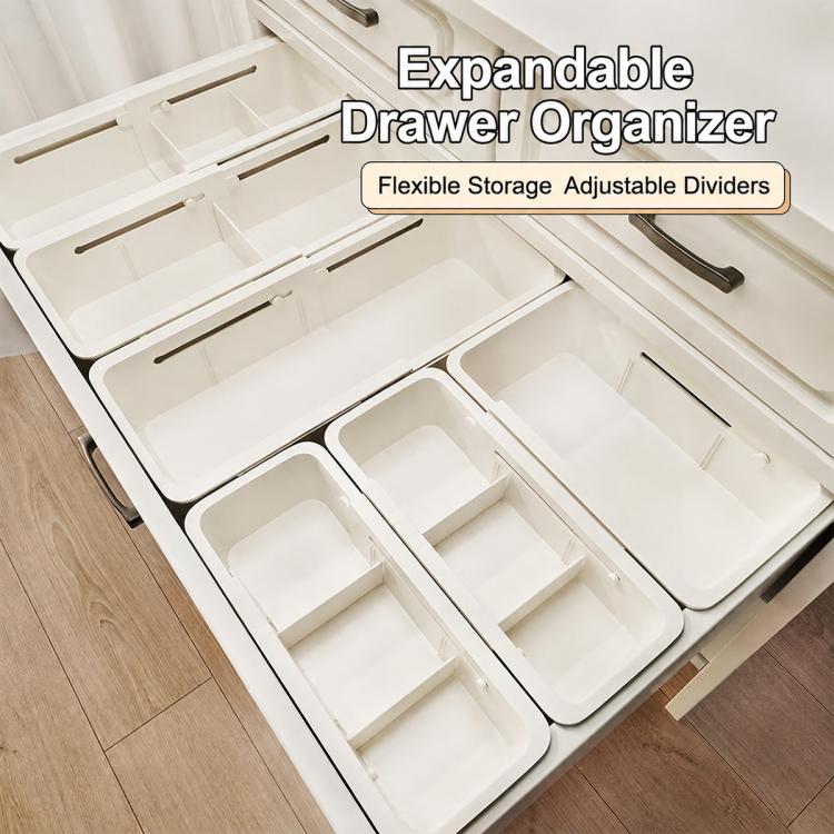 White expandable drawer organizer with multiple lift-out compartments for easy sorting