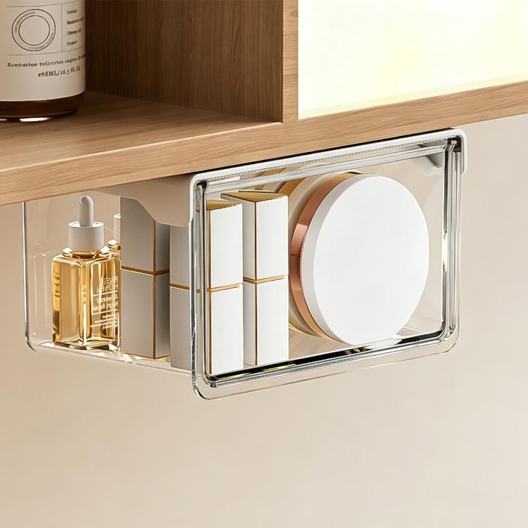 Clear pull-out storage drawer with metal side rails, holding bottles and paper rolls