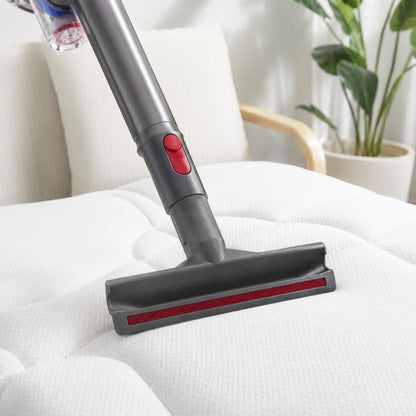 Wide flat mattress brush head with red bristle strip mounted on vacuum wand