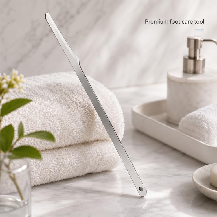 Stainless steel heel callus scraper with curved blade and handle hole for hanging