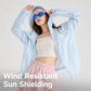 Light blue hooded sun protection coat, zip front, worn with sunglasses