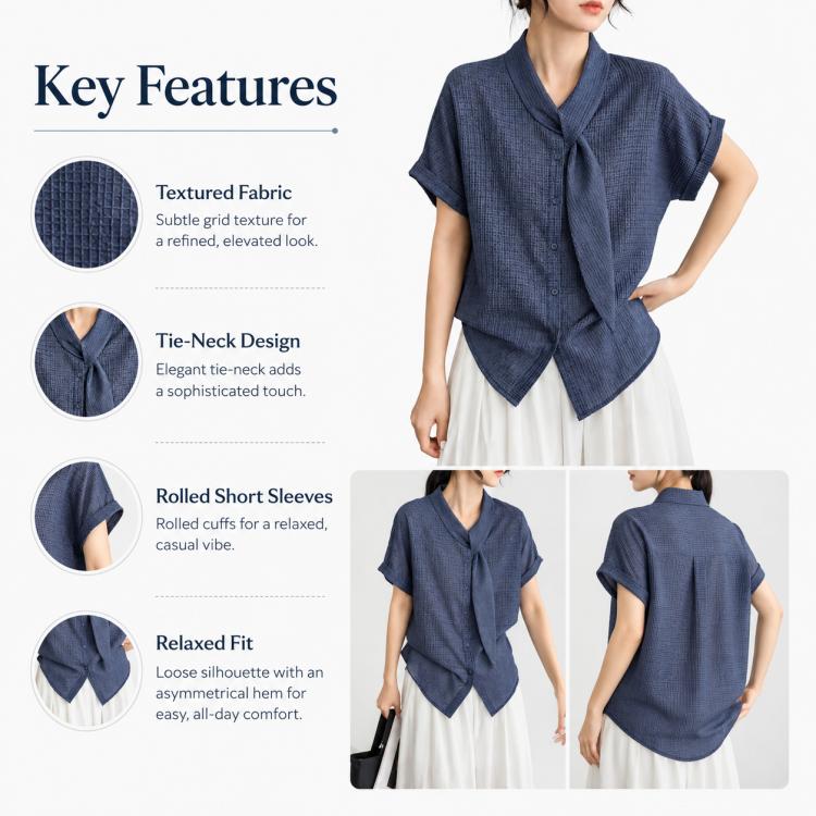 Women’s tie-neck button-front short-sleeve blouse in textured dark blue with rolled cuffs.
