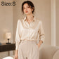 Cream satin long-sleeve button-up shirt with pointed collar and button placket