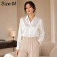 White satin long-sleeve button-up shirt with pointed collar and full button front