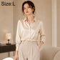 Cream satin long-sleeve button-up shirt with pointed collar, cuffs, and button front
