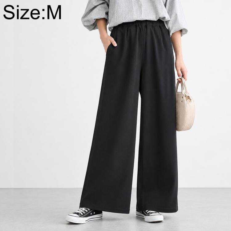 High-waisted wide-leg women’s pants with elastic waist, solid black.