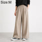 High-waisted wide-leg women’s pants with elastic waist, solid beige.