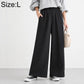 High-waisted wide-leg women’s pants with elastic waist, solid black.