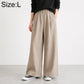 High-waisted wide-leg women’s pants with elastic waist, solid beige.