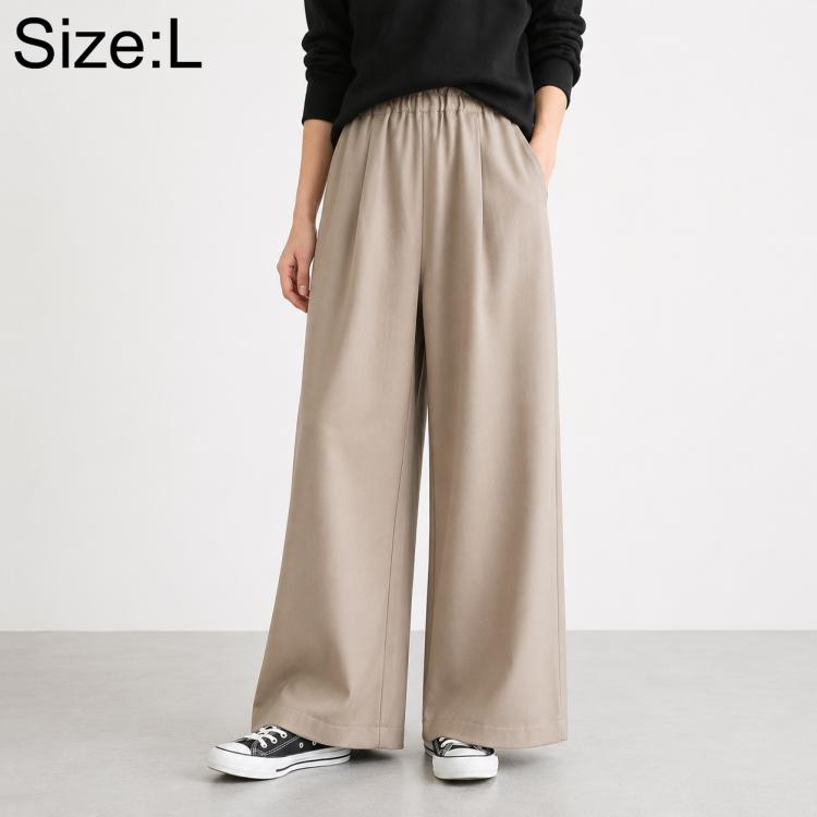 High-waisted wide-leg women’s pants with elastic waist, solid beige.