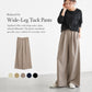 Beige high-rise wide-leg pants with elastic waistband and soft drape