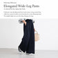 Navy blue high-rise wide-leg pants with elastic waistband and relaxed drape