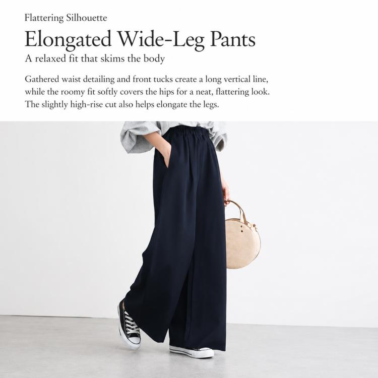 Navy blue high-rise wide-leg pants with elastic waistband and relaxed drape